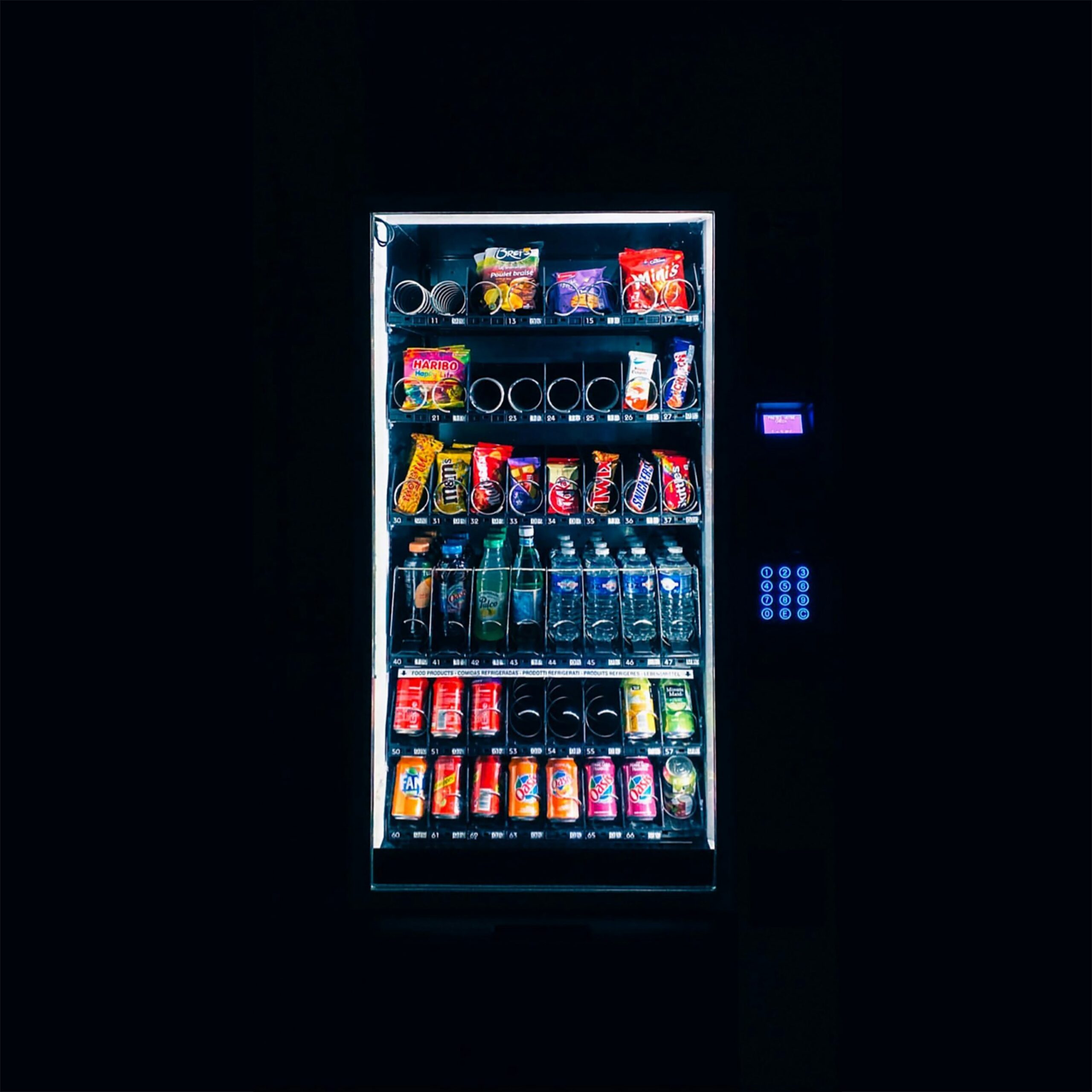 All-in-one combo vending machine stocked with snacks and beverages